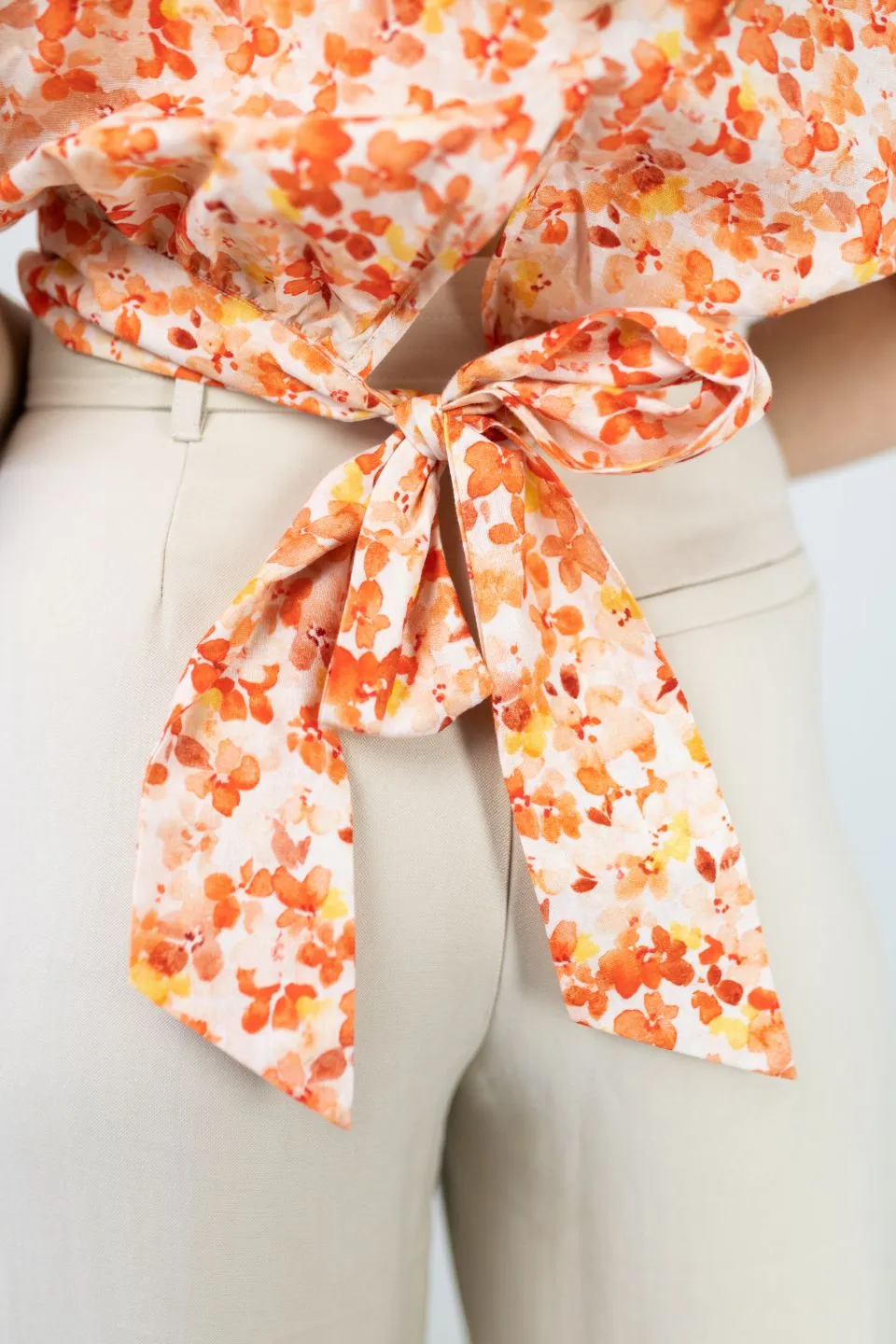 Siena Orange Burst Floral Puff SS Back Hem Tie Top